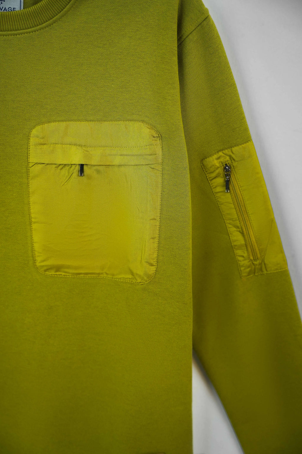 Pocket close-up highlighting stitching on Olive Green Sweatshirt