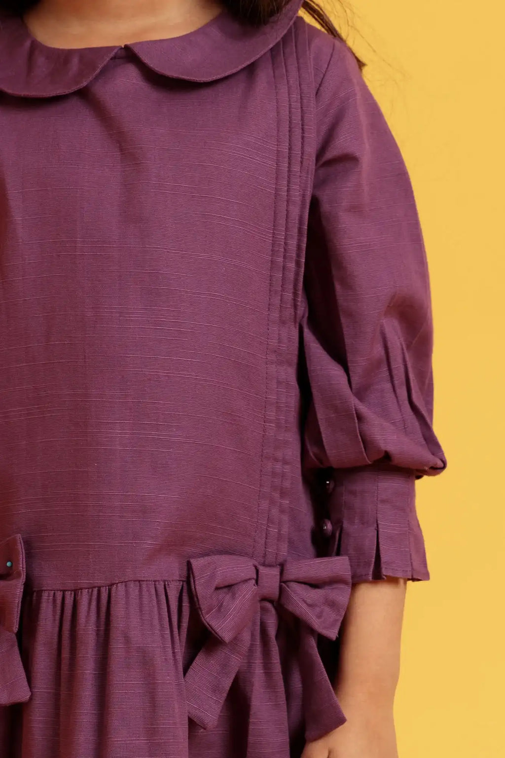Purple dress with a bow detail 