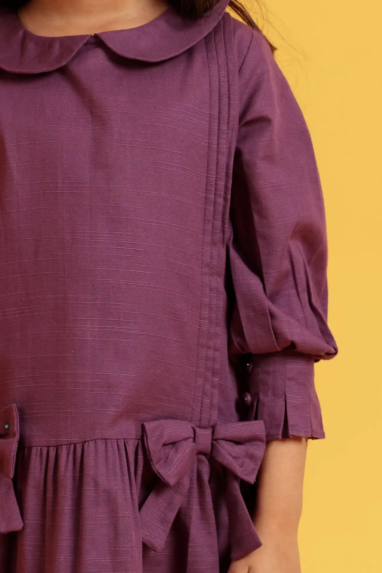 Purple dress with a bow detail 