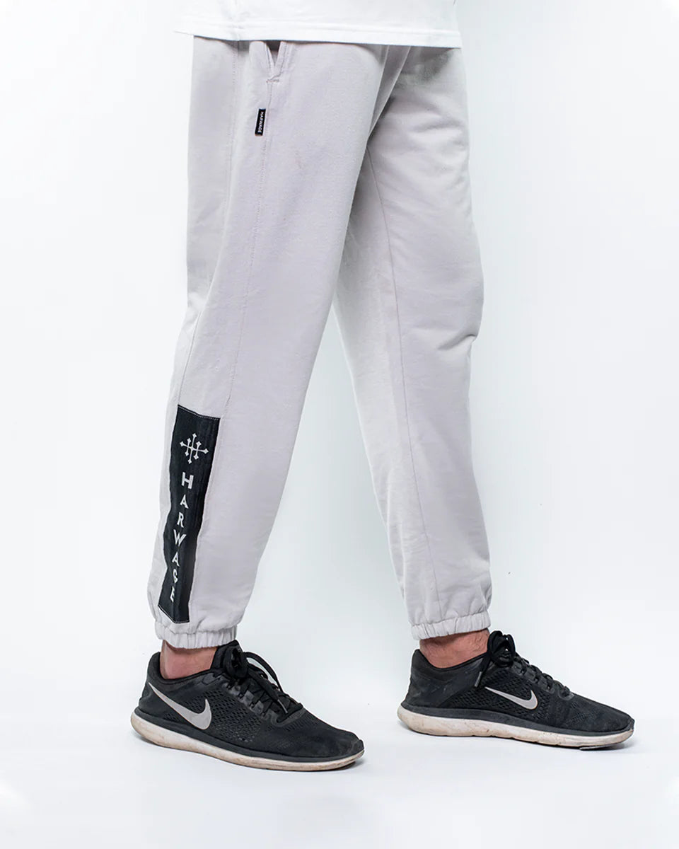 Men’s quiet grey trousers with contrast trims