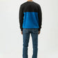 Rear standing view of Blue Signature Sweatshirt worn with jeans