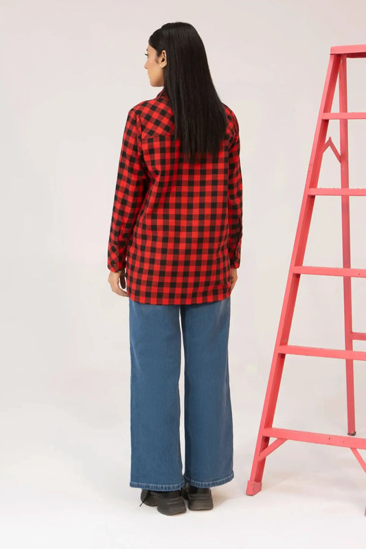 Model wearing a red and black checkered shirt