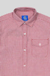 Red and white checkered shirt with a visible brand label on a light gray background