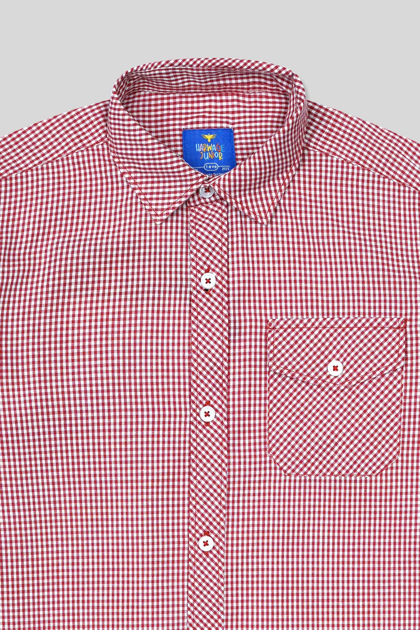 Red and white checkered shirt with a visible brand label on a light gray background