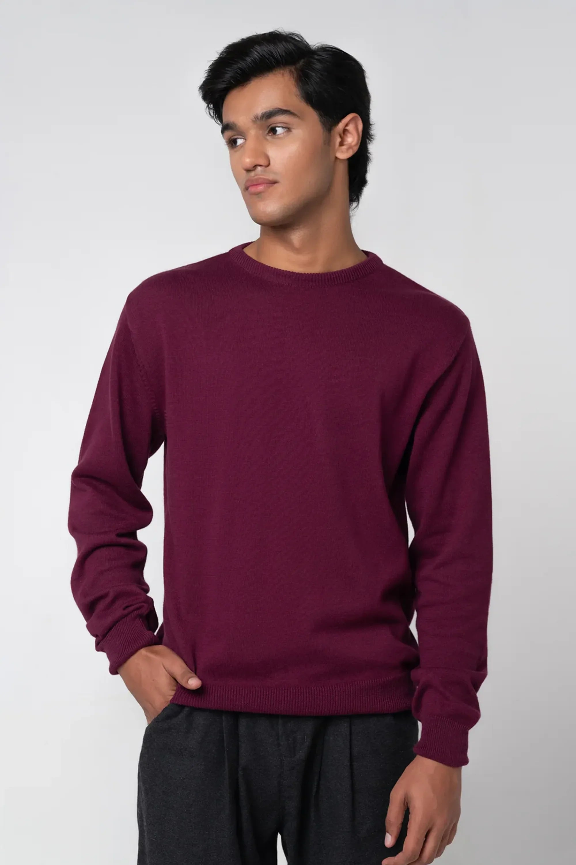 Relaxed front stance showcasing crew neck sweater maroon fit