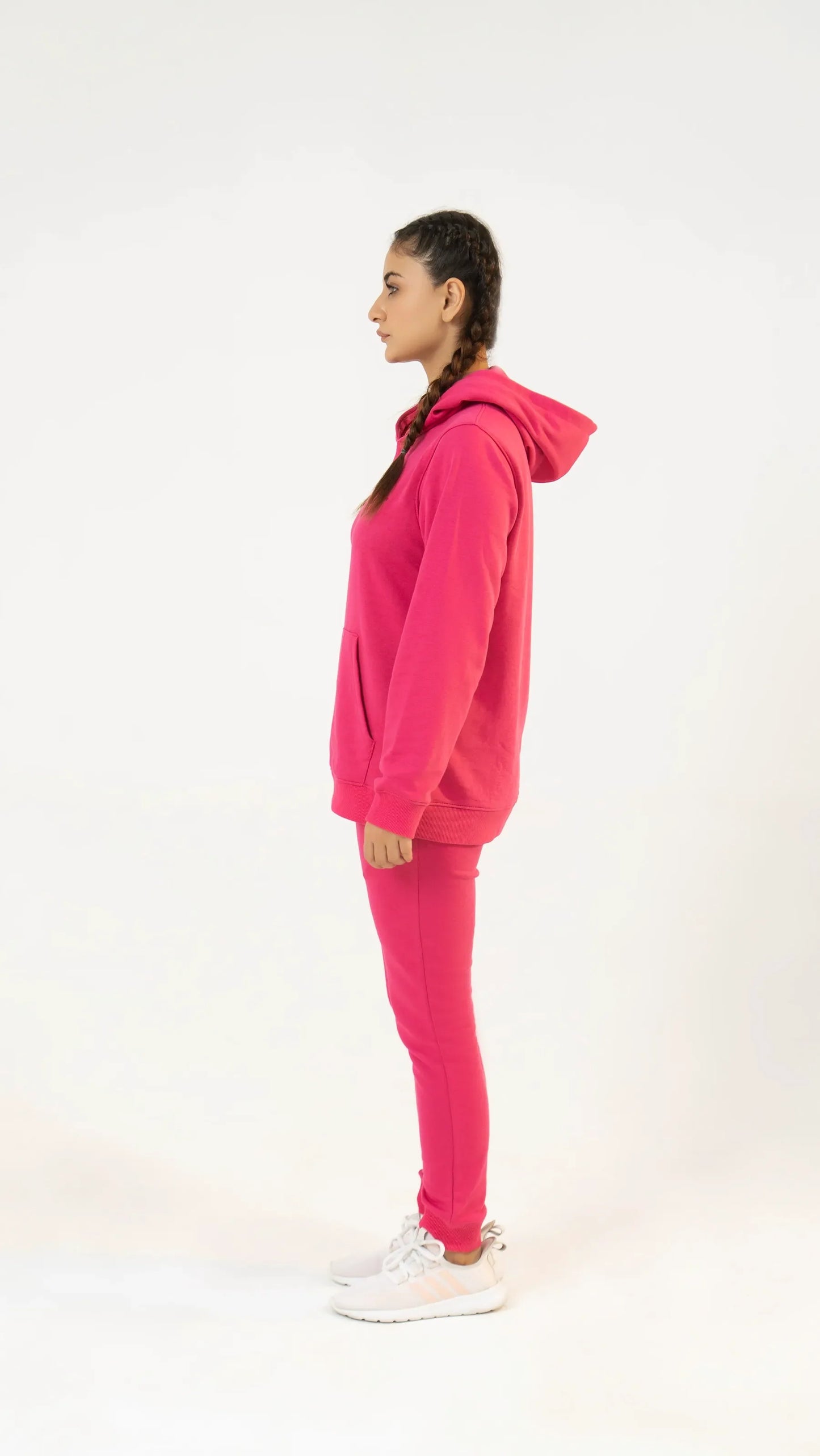 Side view of women’s fuchsia pink regular tracksuit