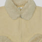 Skin wool cardigan with fur collar and cuffs on a white background