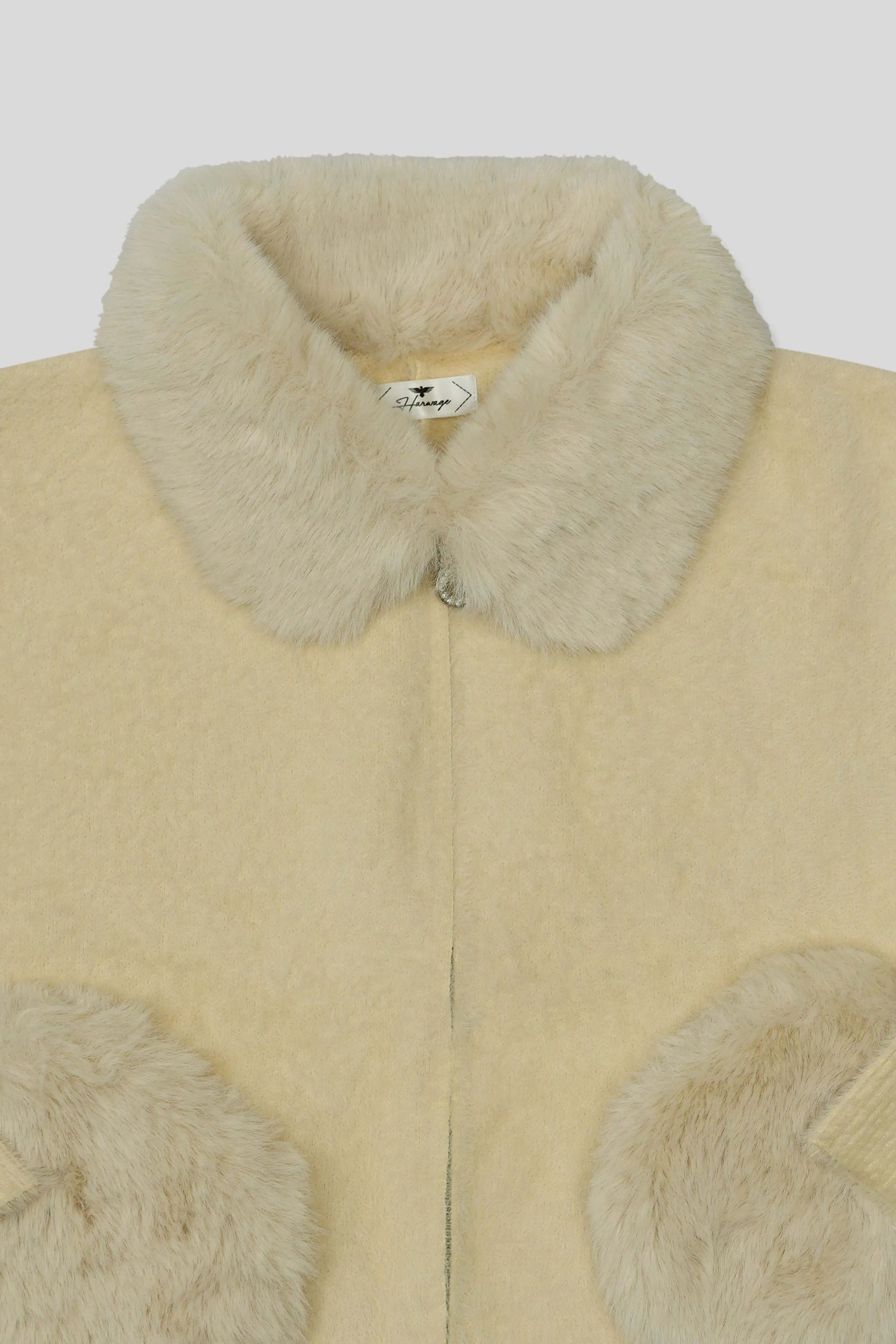 Skin wool cardigan with fur collar and cuffs on a white background