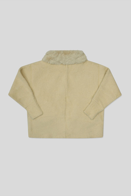 Skin wool cardigan with fur collar on a light gray background