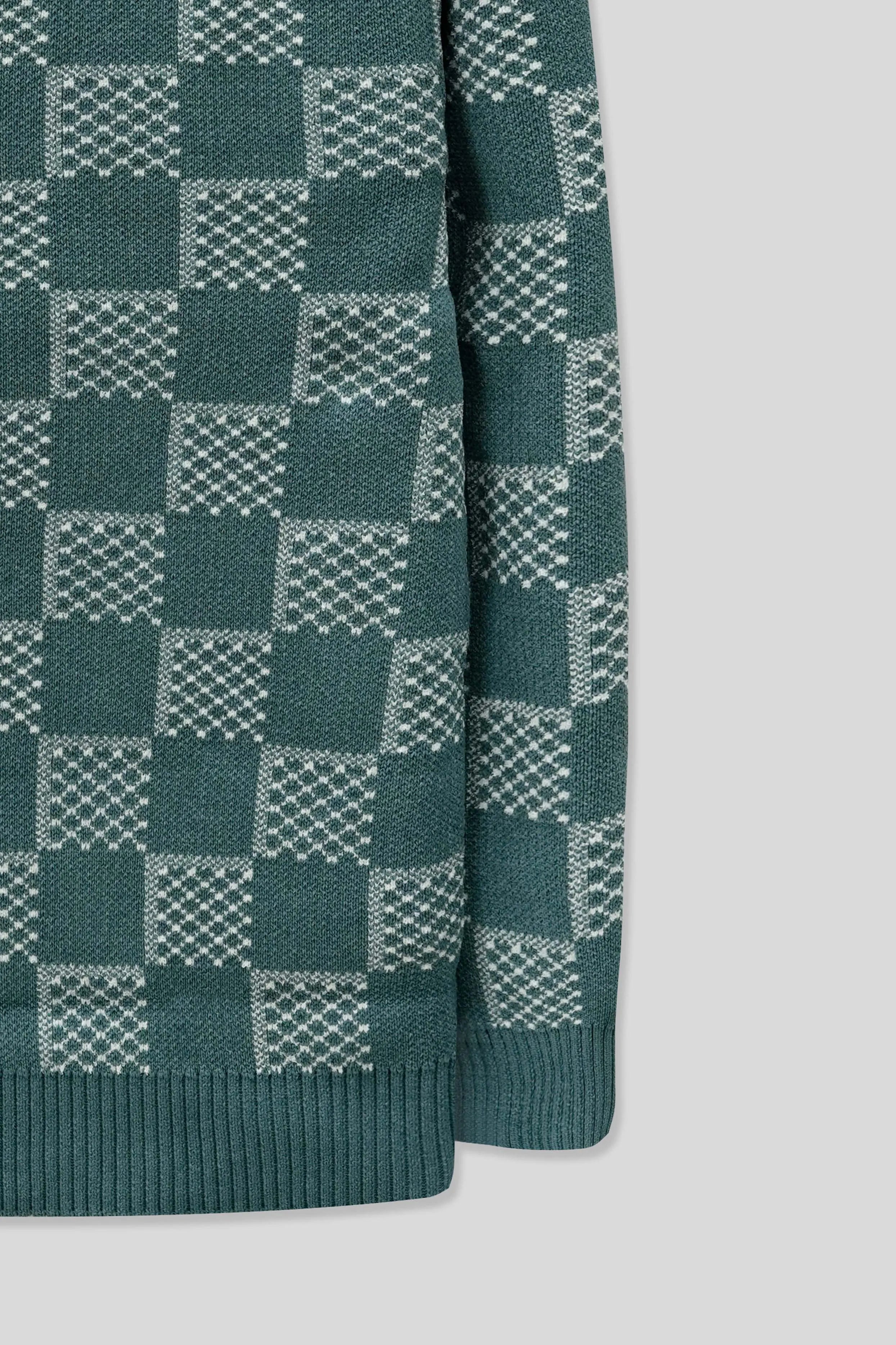 Sleeve-side detail displaying a checkered pattern on a blue wool cardigan