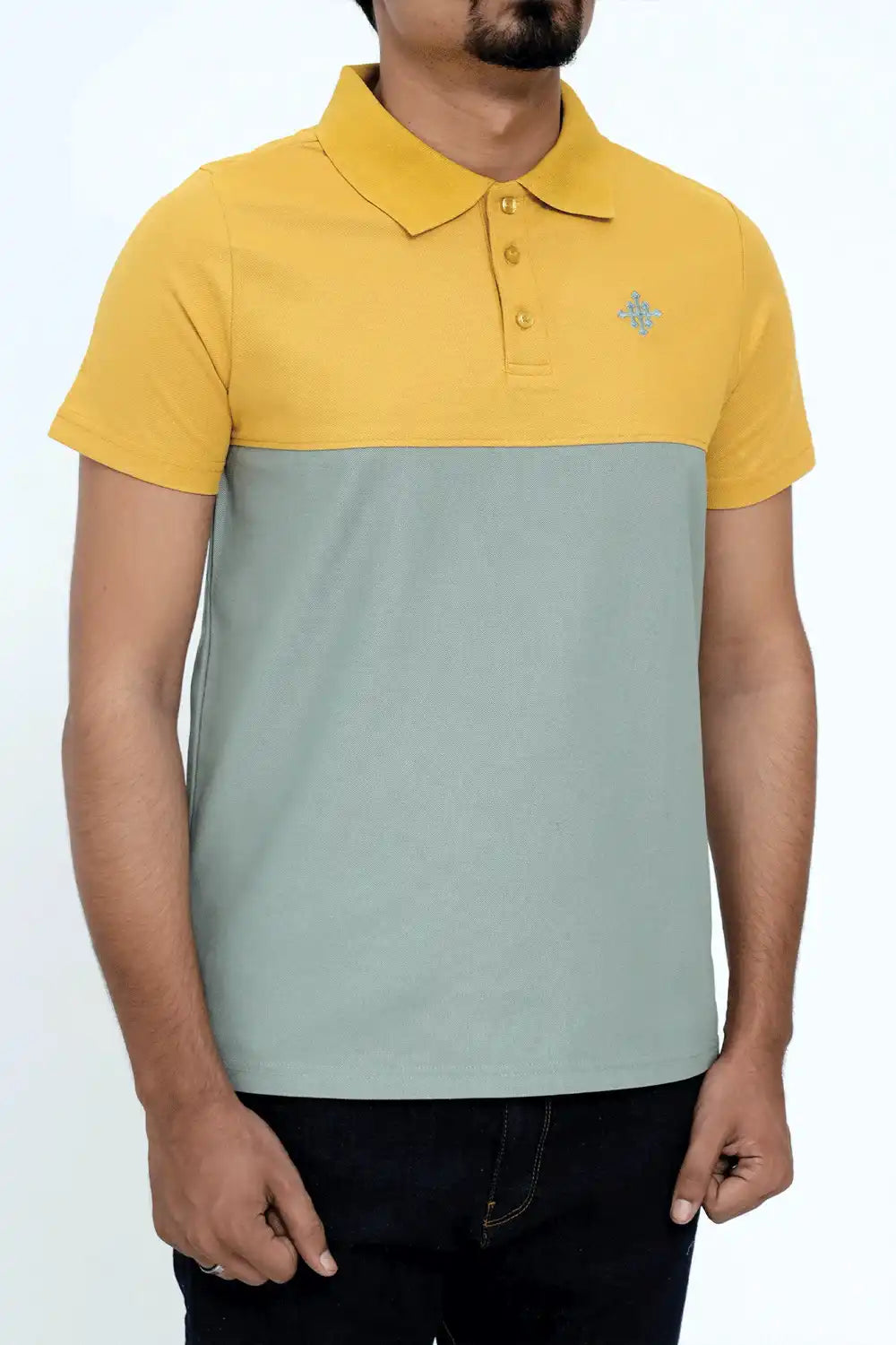 Person wearing a two-tone yellow and gray polo shirt