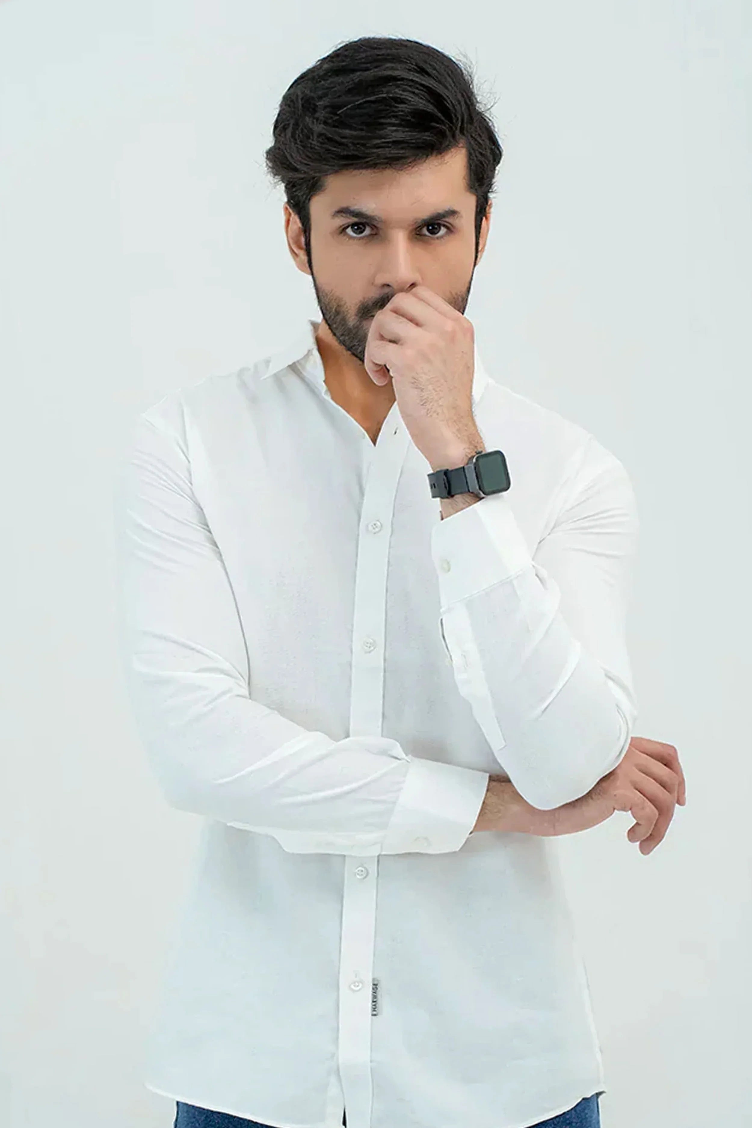 White Oxford Shirt worn by model with rolled sleeves and classic fit