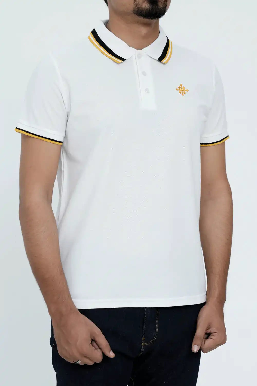 White polo shirt with black and gold trim worn by a person on a white background