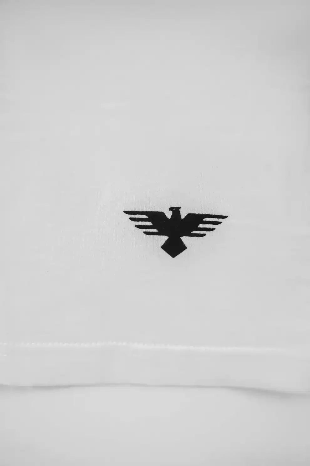 White sweatshirt with a black eagle logo