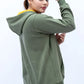 Woman styled in an Olive Green Zipper Hoodie