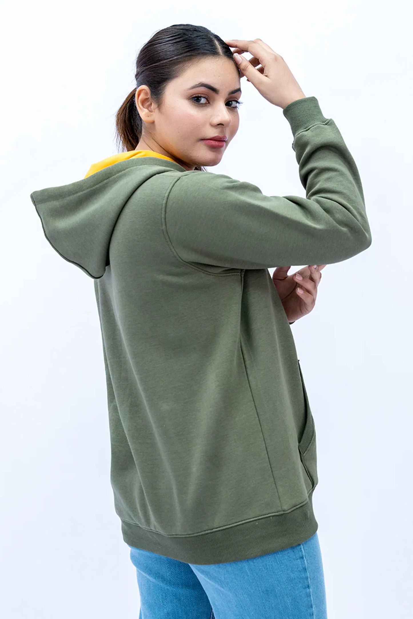 Woman styled in an Olive Green Zipper Hoodie