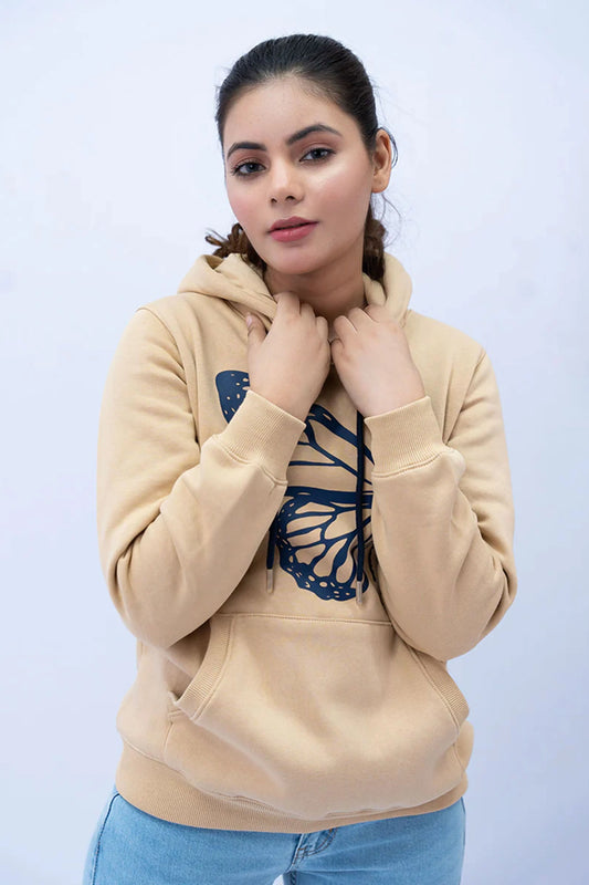 Woman styling a Beige Hoodie with a relaxed silhouette and soft finish