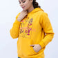 Woman wearing a Mustard SLV Panel Hoodie with printed front and pocket detail