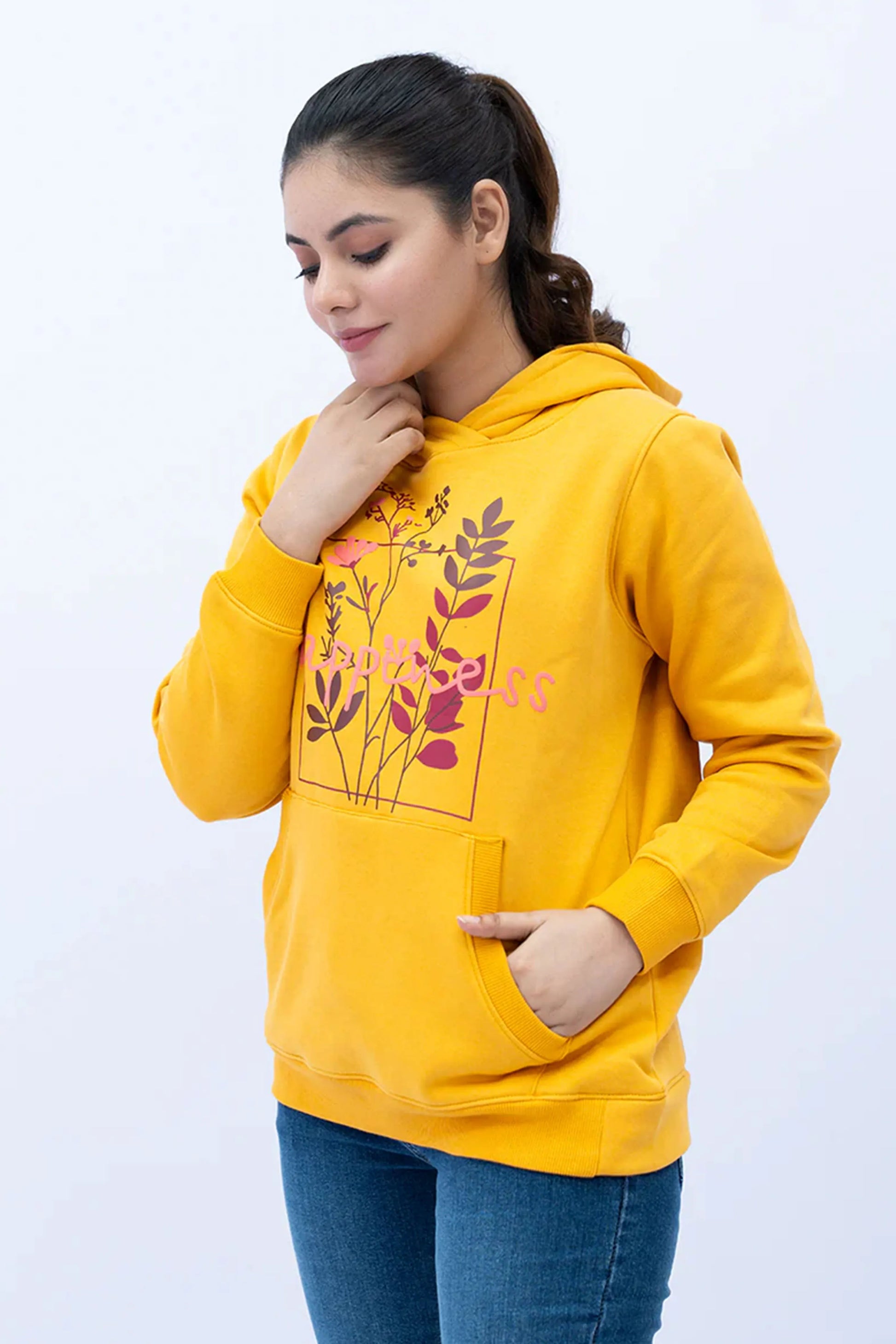 Woman wearing a Mustard SLV Panel Hoodie with printed front and pocket detail
