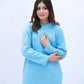 Woman wearing a light blue outfit on a white background