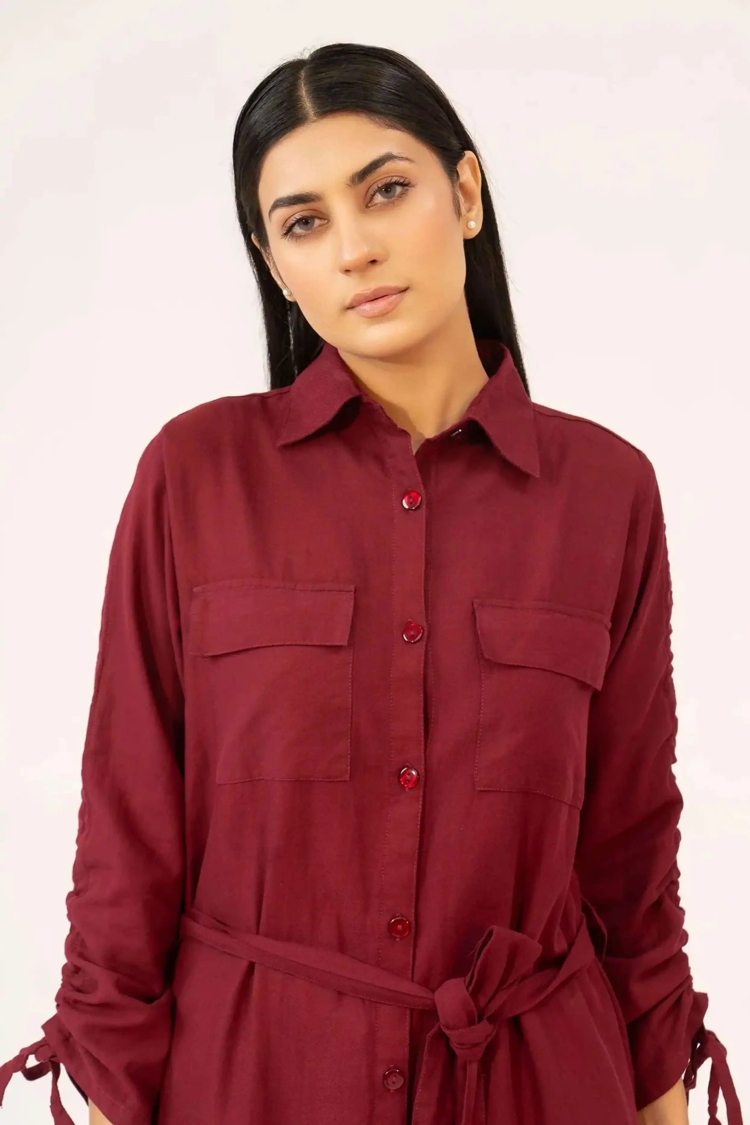 Woman wearing a maroon shirt