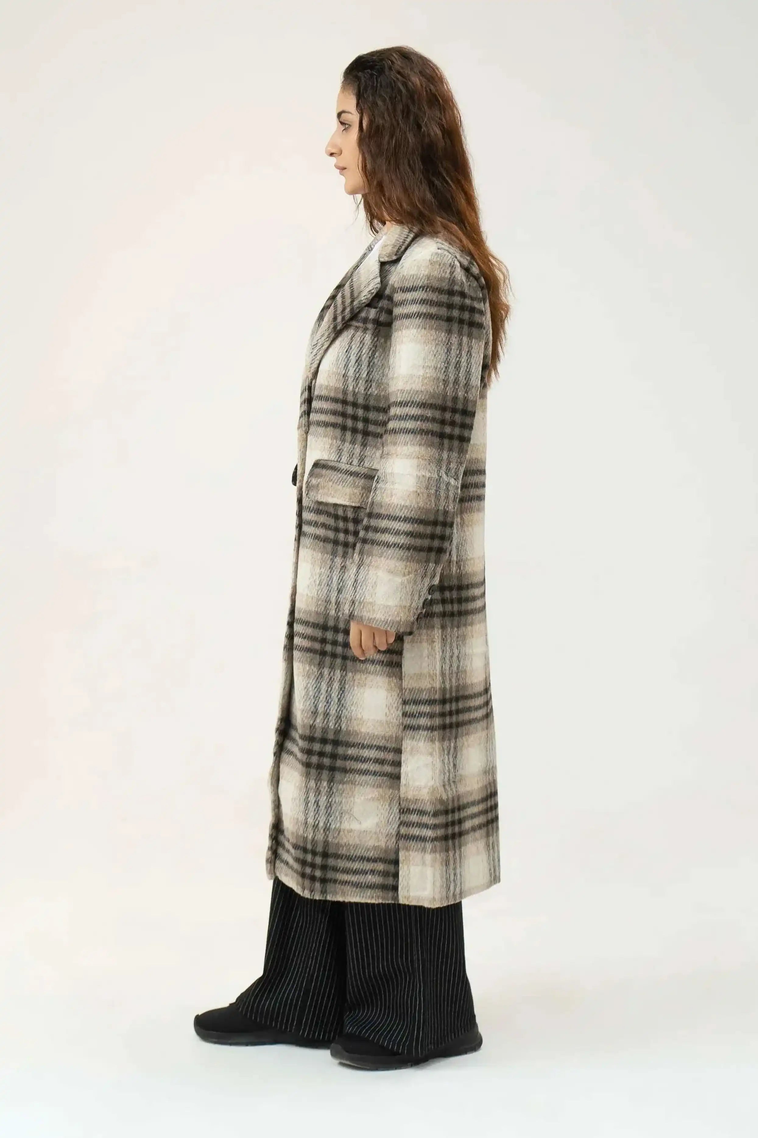 Woman wearing a plaid coat 