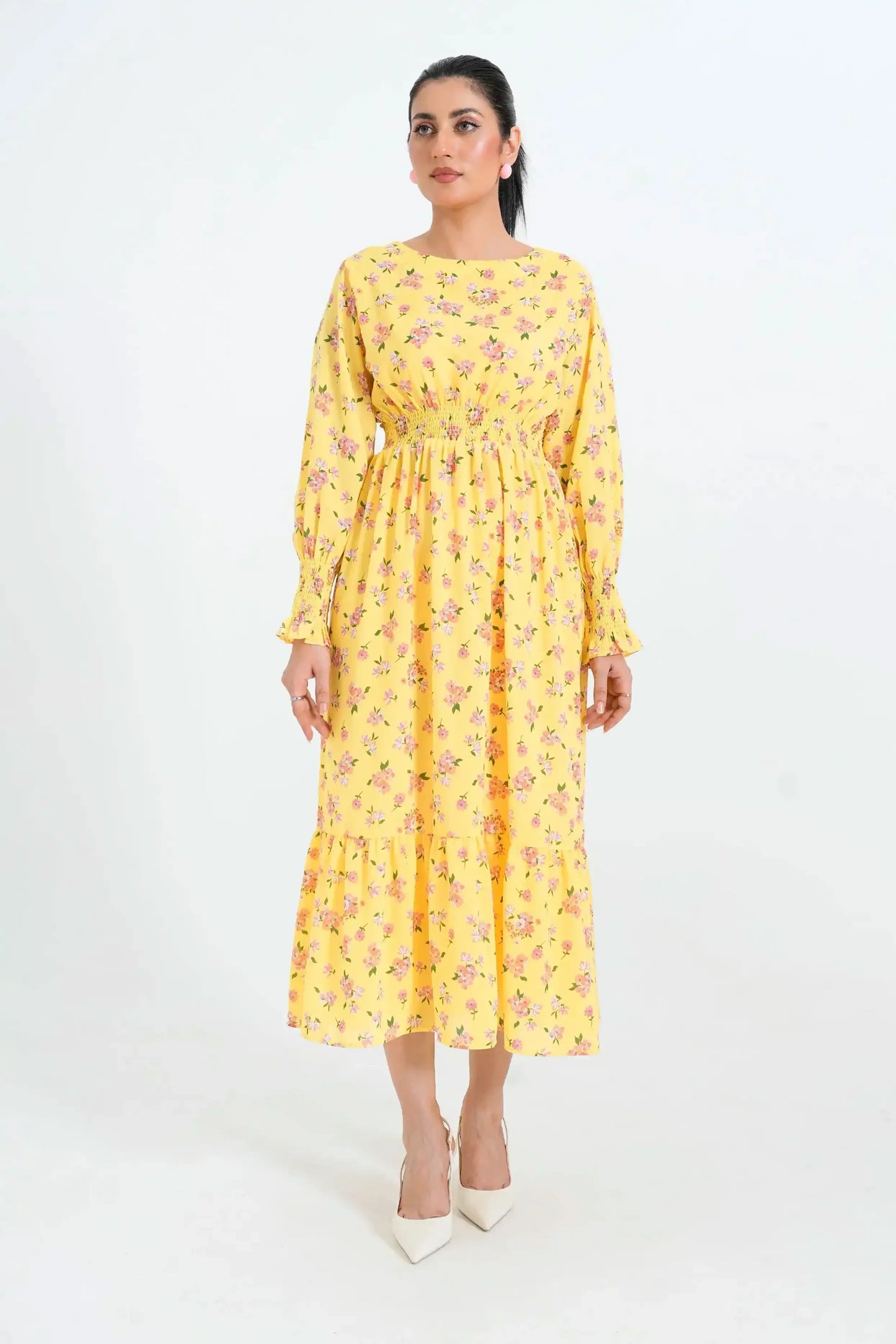 Woman wearing a yellow floral dress