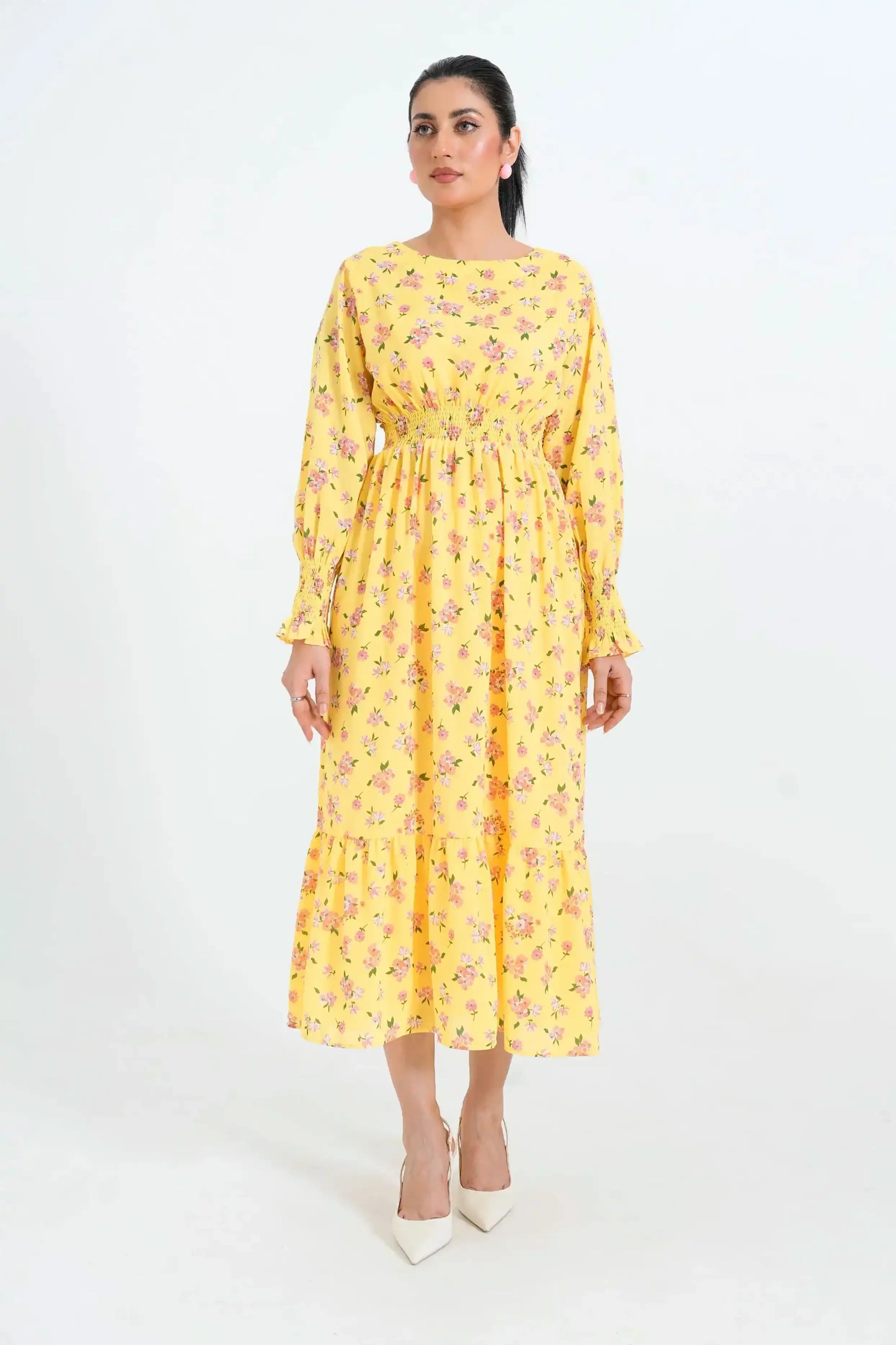 Woman wearing a yellow floral dress