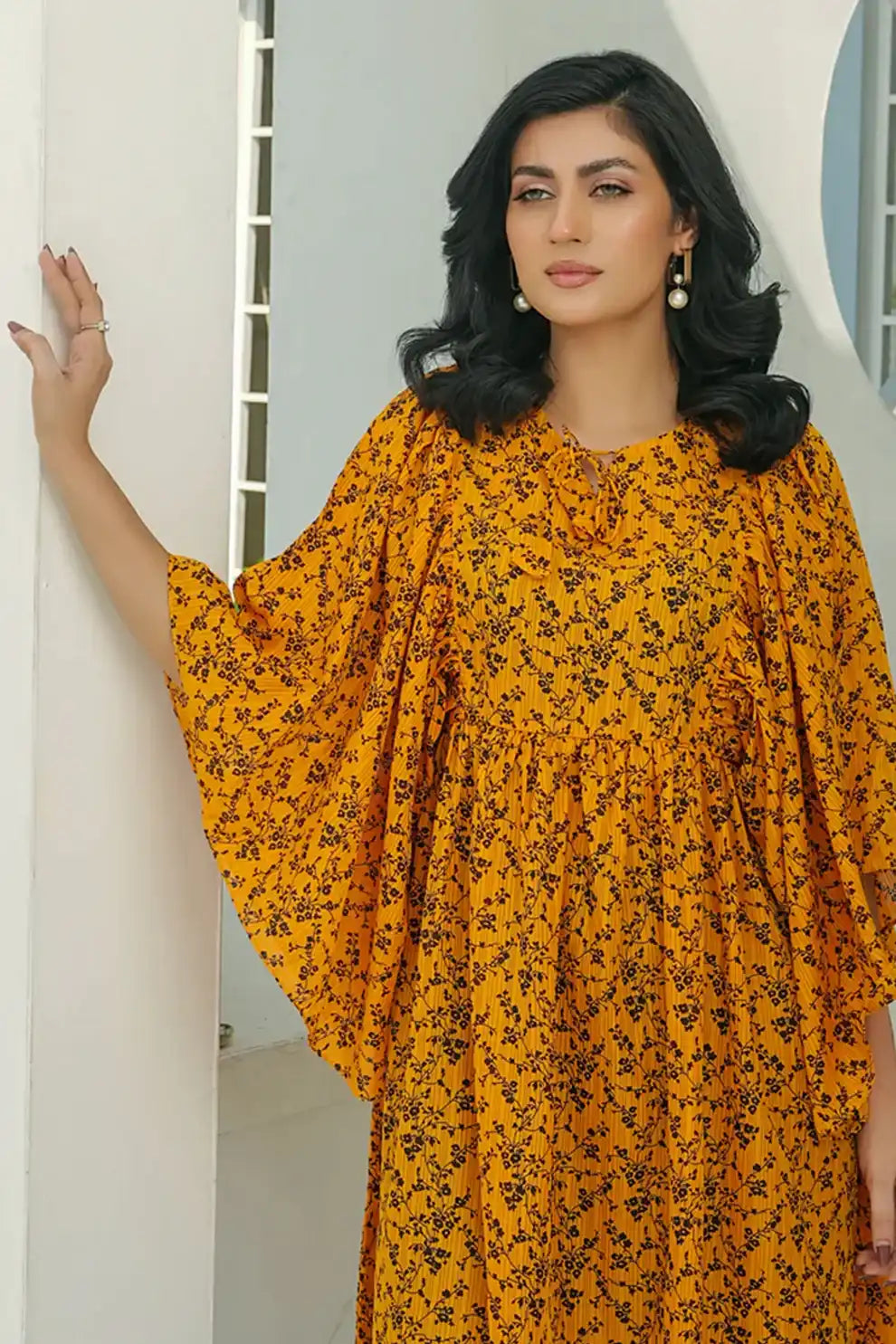 Woman wearing an Orange floral shirt