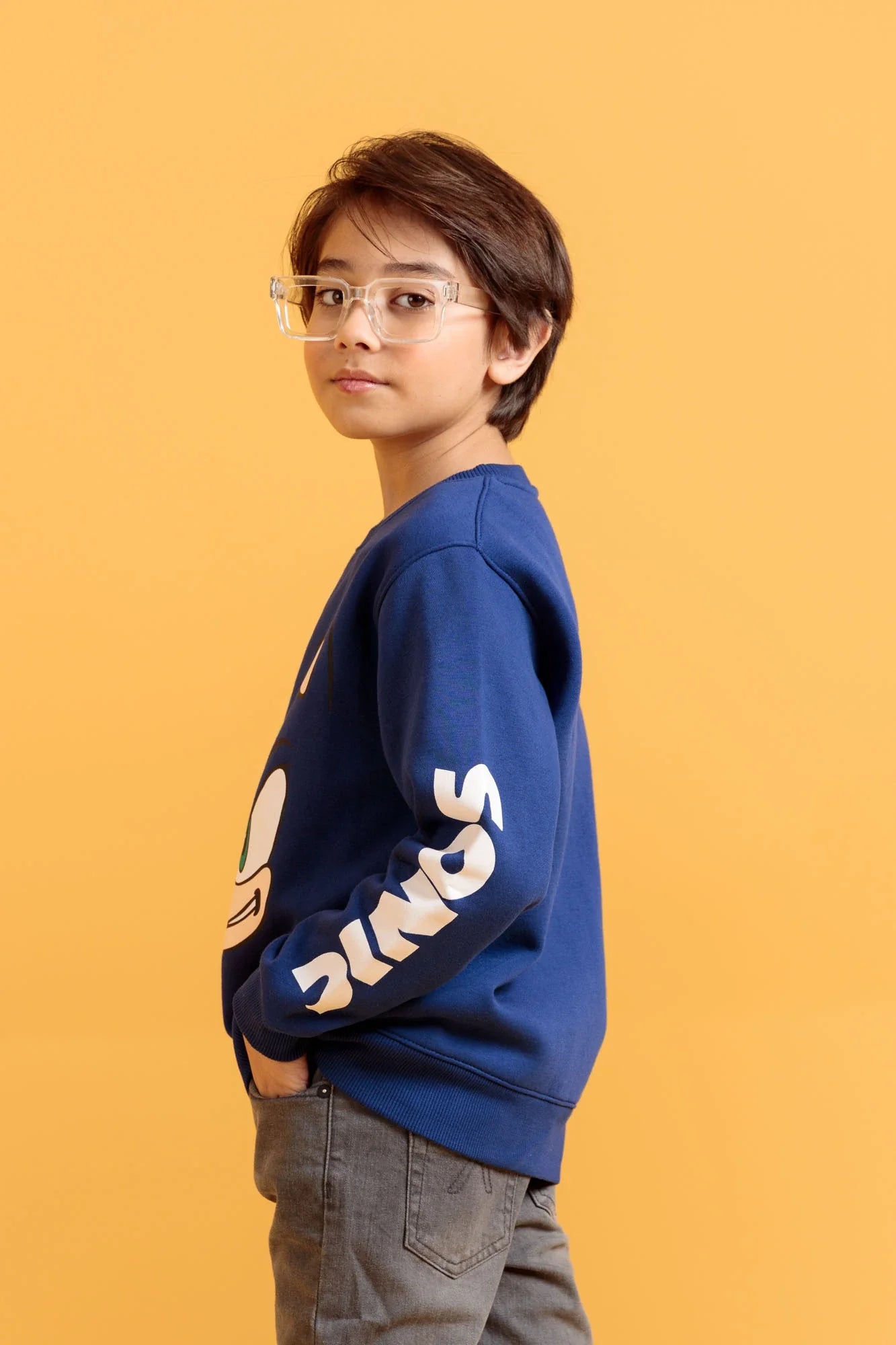 Young boy modeling blue screen print sweatshirt