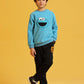 Young boy styling a blue sweatshirt with black trousers