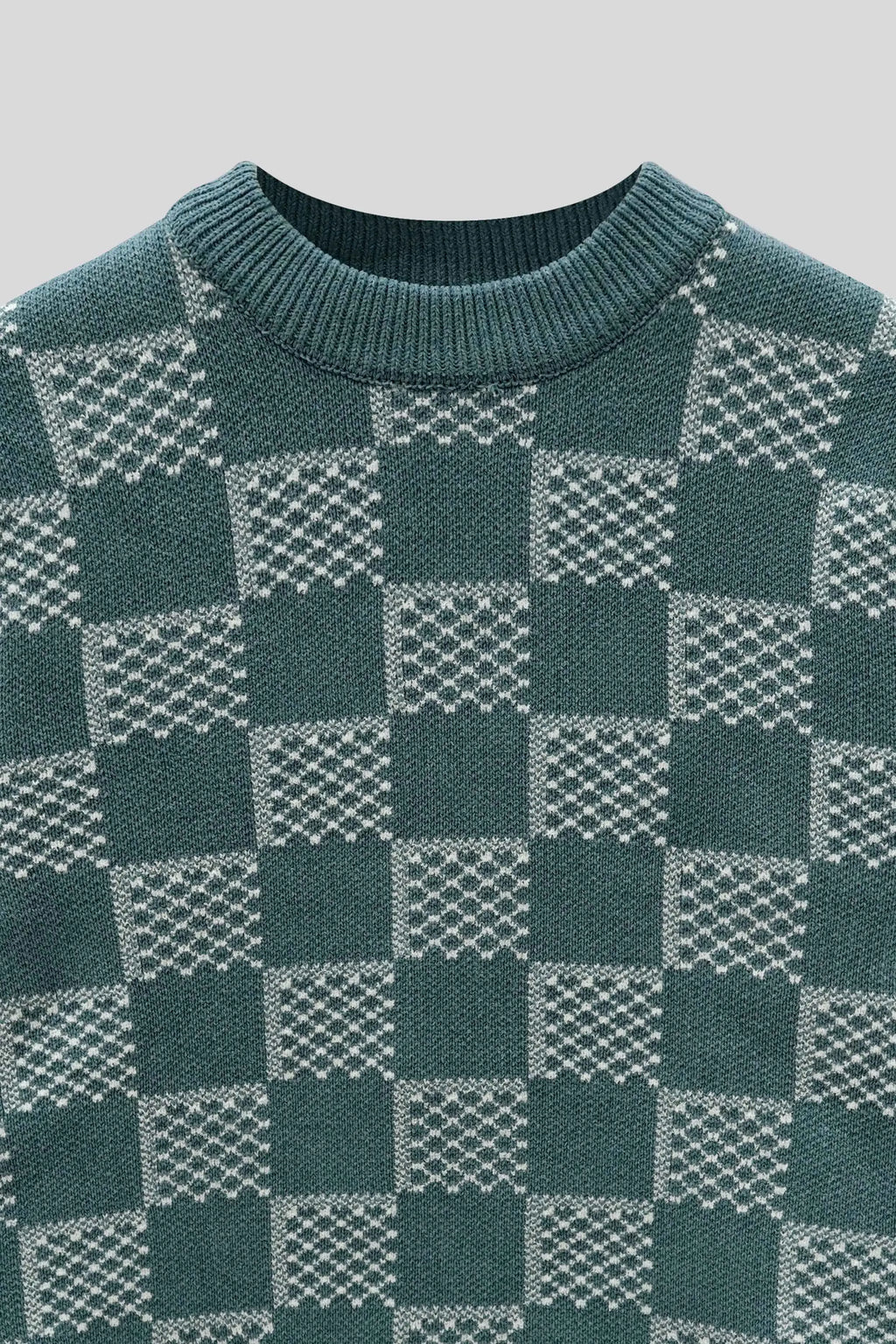 Pattern close-up highlighting the knit texture of the stone wool cardigan, blue
